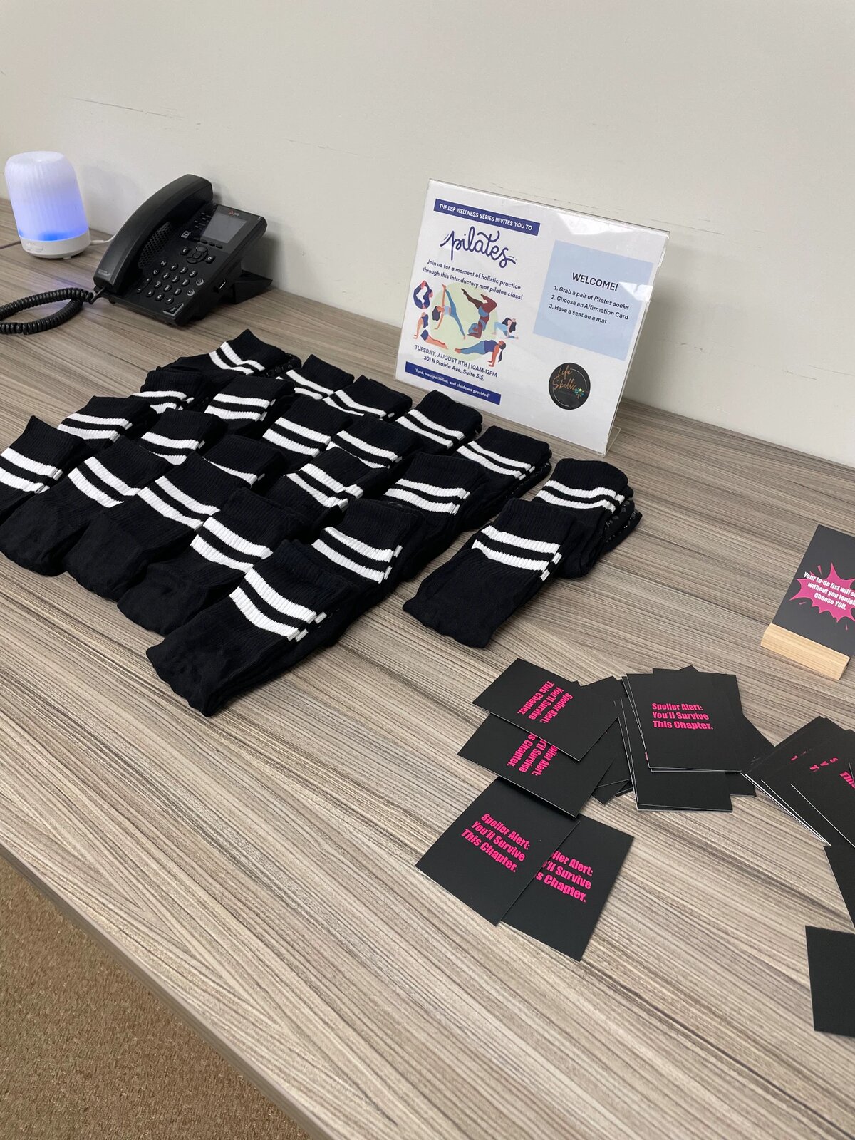 Welcome table with pilates socks and affirmation cards